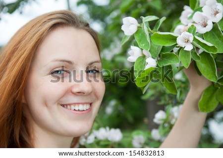 Laughing woman with cherry blossom