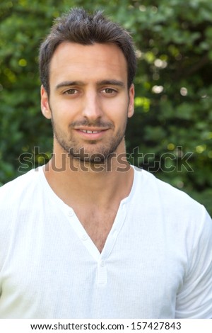 Smiling latin man in a park