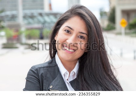 Laughing latin woman in the city