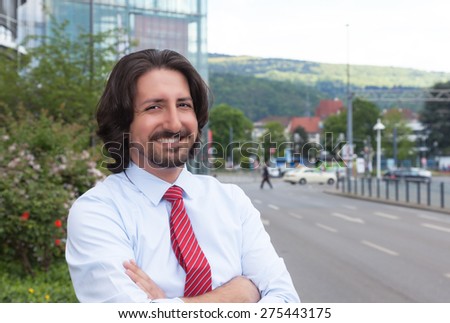 Cool turkish businessman outside in front of his office