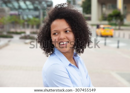 African american woman in the city looking around