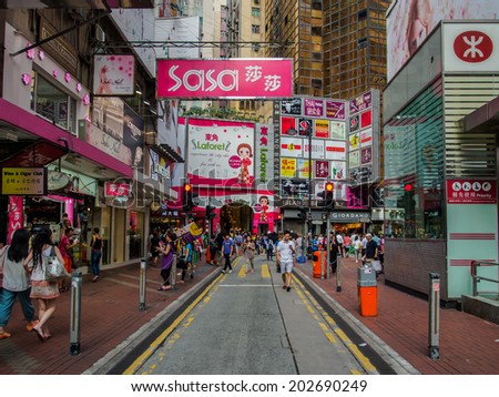 HONG KONG, CHINA - JUNE 21: People walking in pedestrian area at Causeway Bay, Hong Kong island, on June 21, 2014. Hong Kong is considered to be one of the most densely populated areas in the world.