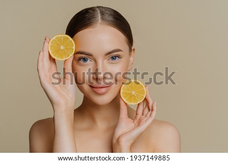 Similar – Image, Stock Photo Young Woman Holding Lemon Slices Over Eyes Smiling Widely