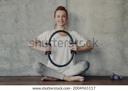 Similar – Image, Stock Photo Cheerful barefoot ginger woman waking up on bed