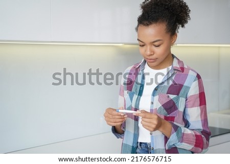 Similar – Image, Stock Photo Young spanish woman with curly hair showing victory sign with a cute smiling face while working on his laptop. Close up portrait. Freelancer happy to work by her own