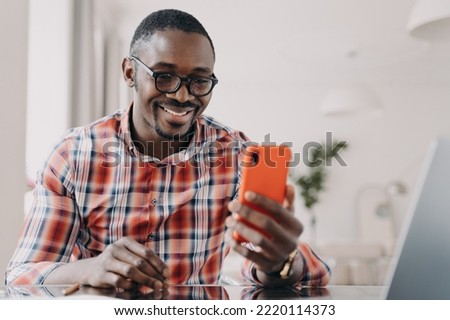 Similar – Image, Stock Photo Stylish black businessman chatting on smartphone against building wall