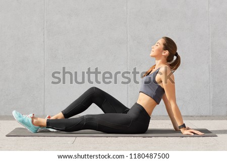 Similar – Image, Stock Photo Flexible acrobatic girl sitting on bed