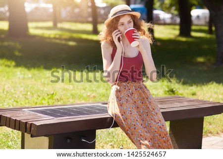 Similar – Image, Stock Photo woman charging batteries in the middle of nature