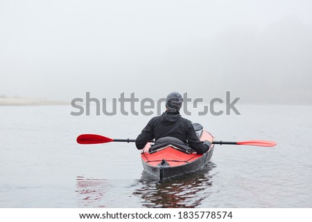 Similar – Image, Stock Photo Pensive man with paddle board before surfing