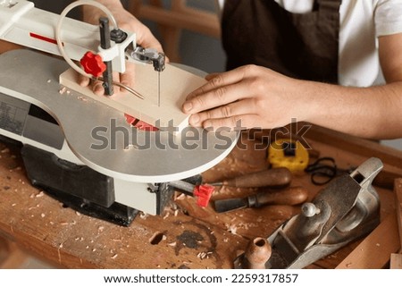 Similar – Image, Stock Photo Faceless male foreman using equipment at workshop