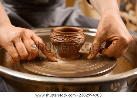 Similar – Image, Stock Photo Ceramist hands make a plate of clay