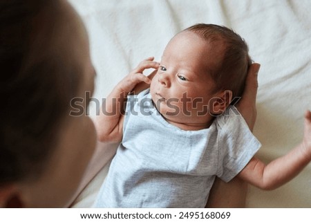 Image, Stock Photo Anonymous kid taking care of tomato plants in garden