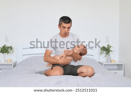 Similar – Image, Stock Photo Surprised newborn girl while relax in her hammock