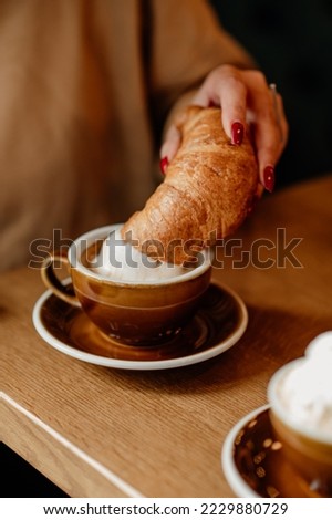 Similar – Image, Stock Photo Fresh Croissant, Cup of Coffee and Ranunculus Flowers. Breakfast