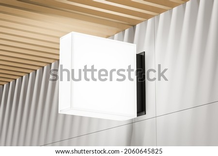 Empty white square shop signboard. Illuminated lightbox on the wall. Mock up. 3d rendering Stockfoto © 