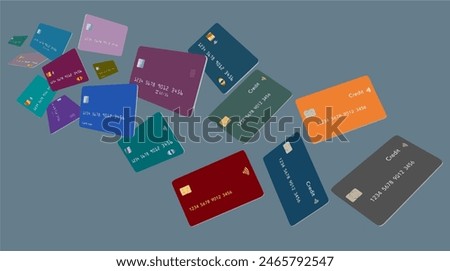 Credit cards, or debit cards, are seen flying and floating, hovering above a grey surface.
