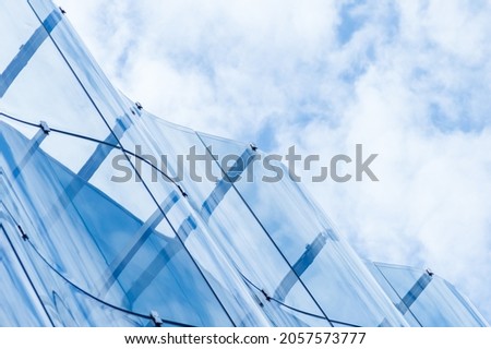 Similar – Image, Stock Photo Glass wavy facade of an office building
