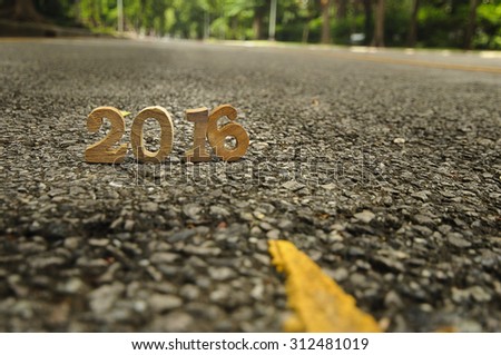 Head to New Year 2016 on road concept, wood number idea