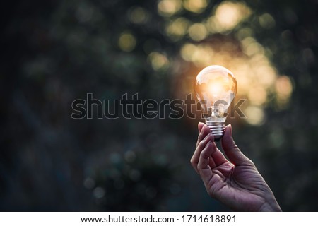 Innovation and energy concept of hand hold a light bulb and copy space for insert text. 商業照片 © 