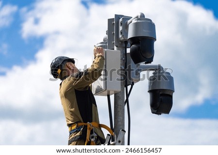 Similar – Image, Stock Photo Pole with city cameras against blue sky