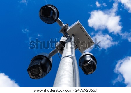 Similar – Image, Stock Photo Pole with city cameras against blue sky