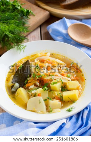 Traditional Russian cabbage soup with proso millet and potato