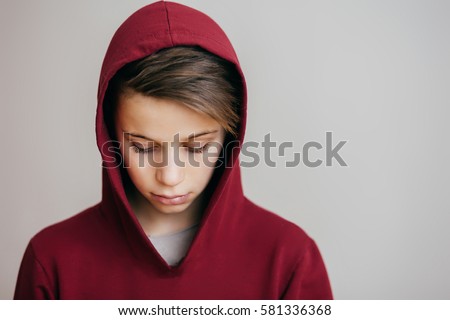 Similar – Image, Stock Photo Sad boy looking down in studio