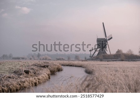 Similar – Image, Stock Photo Windmill at edge of breakwater