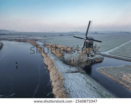 Similar – Image, Stock Photo Windmill at edge of breakwater