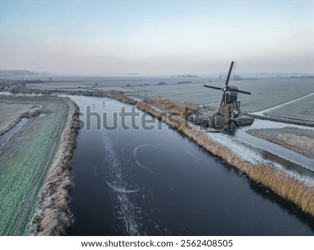 Similar – Image, Stock Photo Windmill at edge of breakwater