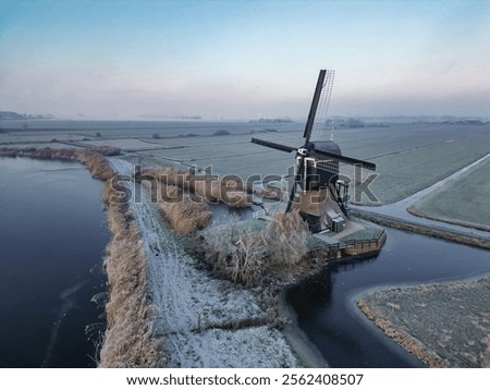 Similar – Image, Stock Photo Windmill at edge of breakwater