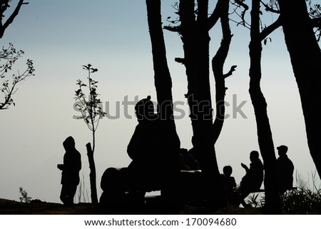 silhouette people sitting  on  bench , Phu Rua  in Thailand