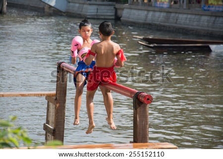 BANGKOK, THAILAND - FEB. 14 :traditional water Thai boxing (or Muay Talay) - ancient Thai fight above the water - at Bangkok floating market, Thailand on February 14, 2015.