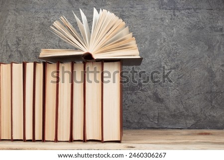 Similar – Image, Stock Photo Pile of books and dried flowers on wooden table