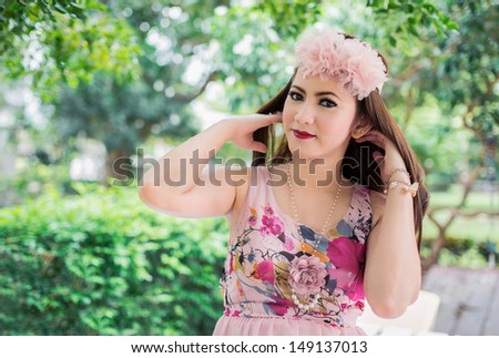 Beautiful woman relaxing in the garden