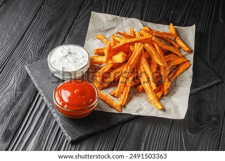 Foto Bild Süßkartoffelpommes in einer Schüssel auf dem Tisch