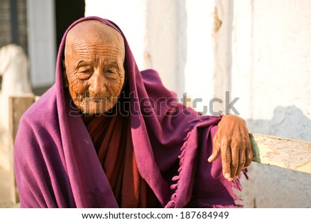 NYAUNGSHWE - MYANMAR - MARCH 2 : Unidentified Burmese Buddhist Monk on March 2, 2014 in Nyaungshwe, Myanmar. In 2012 an ongoing conflict started between Buddhists and Muslims in Myanmar