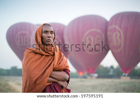 BAGAN, MYANMAR - MARCH 1 : Unidentified Burmese Buddhist Monk on March 1, 2014 in Bagan, Myanmar. In 2012 an ongoing conflict started between Buddhists and Muslims in Myanmar.