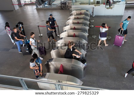BANGKOK, THAILAND-MARCH 16: Unknown people walks pass the gate of Suvarnabhumi Airport Rail Link Station on March 16, 2015 in Bangkok, Thailand. Airport Rail Link opened for service on 23 August 2010.