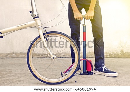 Similar – Image, Stock Photo Inflate bike tires