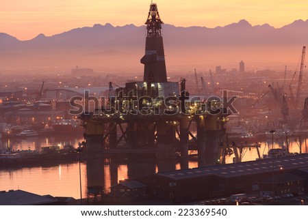 CAPE TOWN, SOUTH AFRICA-OCTOBER, 15: Semi Submersible drilling rig parked in the middle of the shipyard in downtown of Cape Town to get maintenance on October 15, 2013 in Cape Town, South Africa.