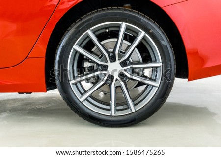Image of rear side sports car wheel with number and markings on tire sidewall Which indicates the size of the tire ,age, load of the tire Foto stock © 