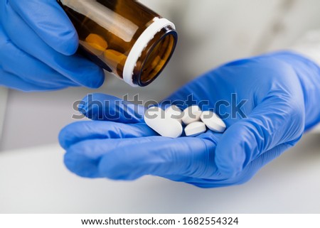 Similar – Image, Stock Photo NHS UK doctor taking patient blood sample