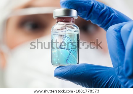 UK lab scientist biotechnologist holding glass ampoule phial with DNA strand,molecule of two polynucleotide chains forming double helix carrying Coronavirus genetic instruction,new strain RNA mutation Imagine de stoc © 