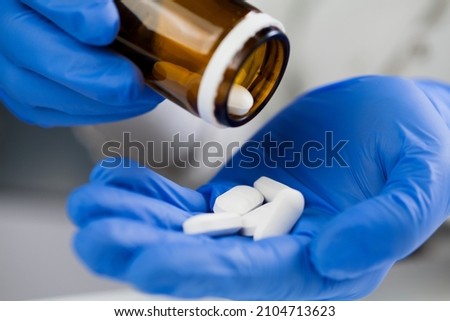 Similar – Image, Stock Photo hands wearing blue gloves holding culture dish