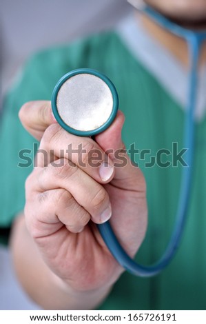 doctor standing with his stethoscope around his neck