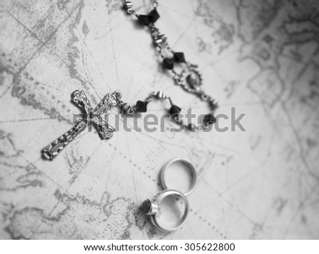 cross and ring on the map