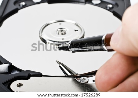 Writing with pen on hard drive