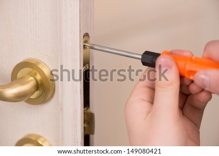Door repairing. Close-up of repairing door