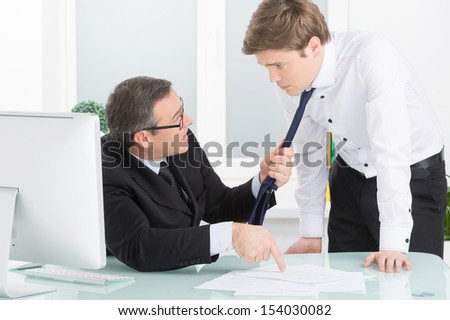 Office conflict. Two men conflicting in the office